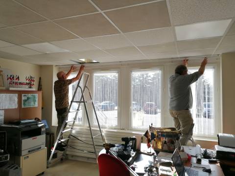 Jacky and Michel puting in place the curtain rods